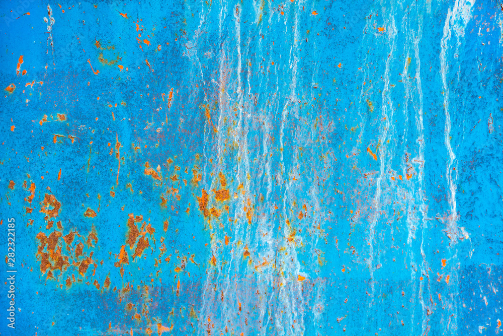Texture of an old metal blue wall with rust, scratches, cracks, smudges and peeling paint. Texture of an old metal blue wall with rust, scratches, cracks, smudges and peeling paint.