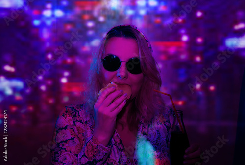 woman in sunglasses with girl neon light reflection