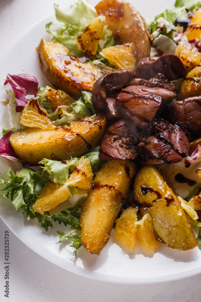 Baked potatoes with boiled chicken liver on a plate Baked potatoes with boiled chicken liver on a plate