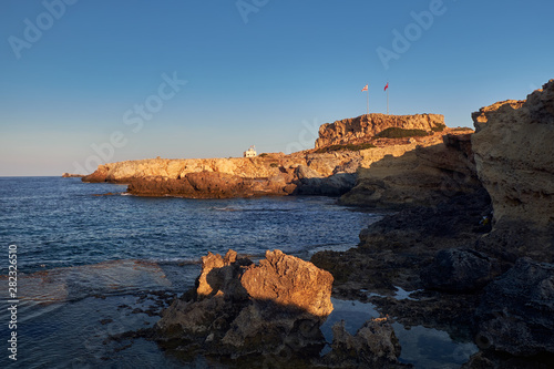 View to the house of workers of the coastline with the flags of Turkey and the Turkish Republic of Northern Cyprus. Afroditi Akraia photo