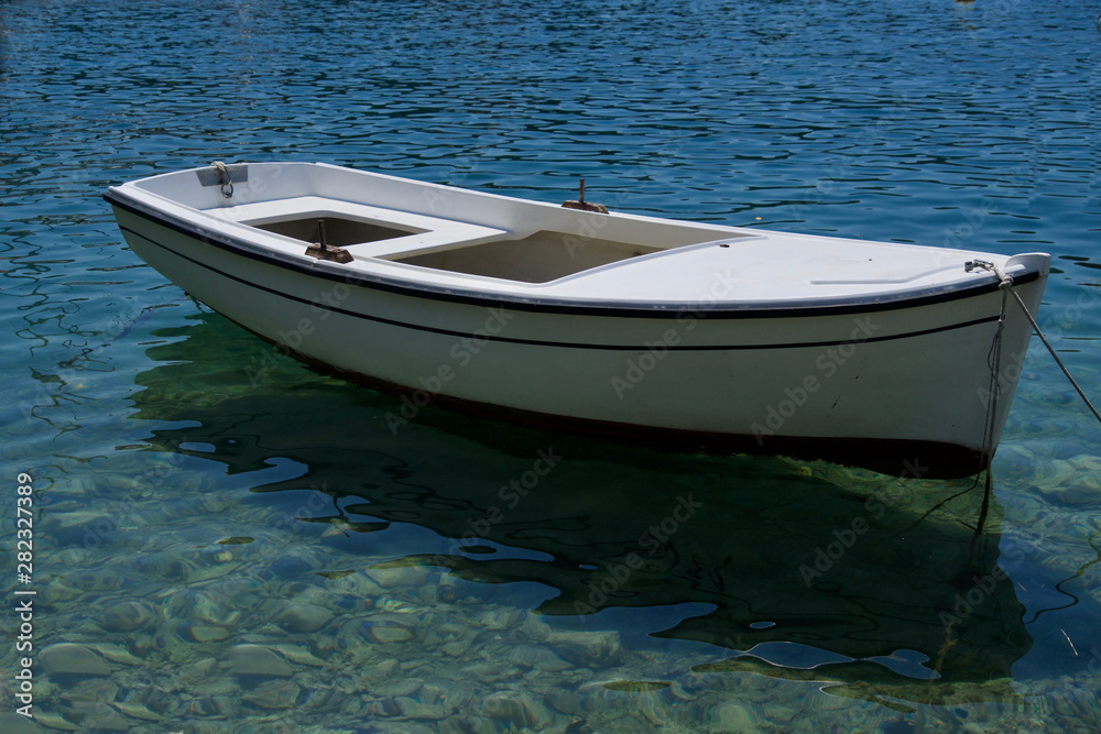 White rowing boat on the water