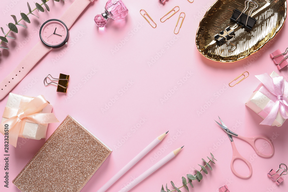 Frame made with scissors, notebook and fashion accessories on pink background, flat lay. Space for text Frame made with scissors, notebook and fashion accessories on pink background, flat lay. Space for text