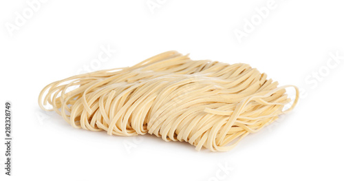 Block of raw egg noodles isolated on white