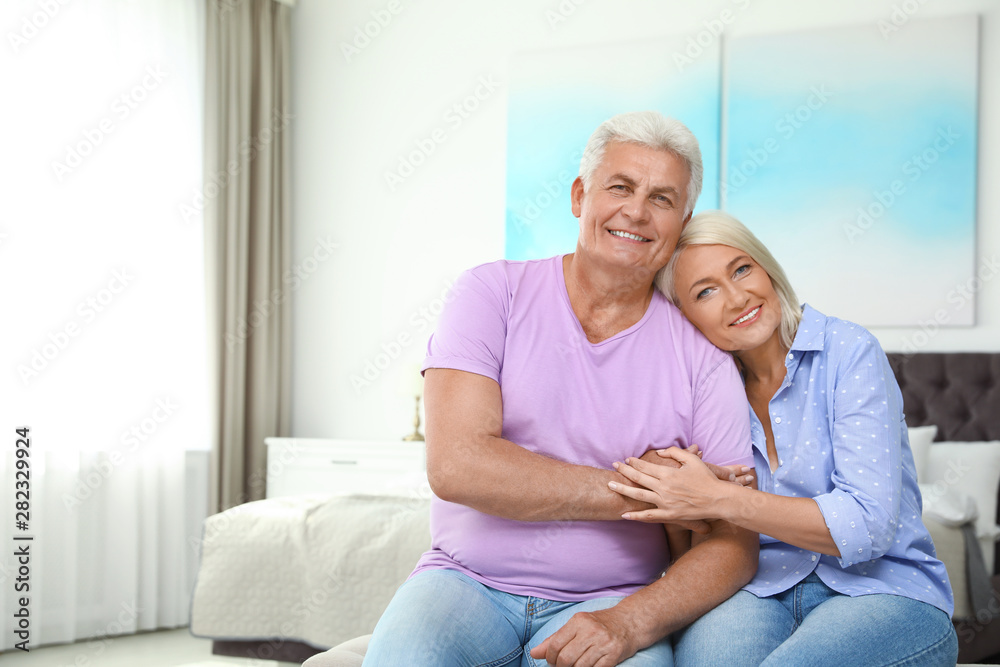 Portrait of happy senior couple at home. Space for text Portrait of happy senior couple at home. Space for text