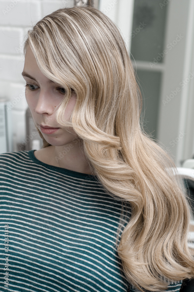 Blonde girl with long hair with wave hairstyle Blonde girl with long hair with wave hairstyle