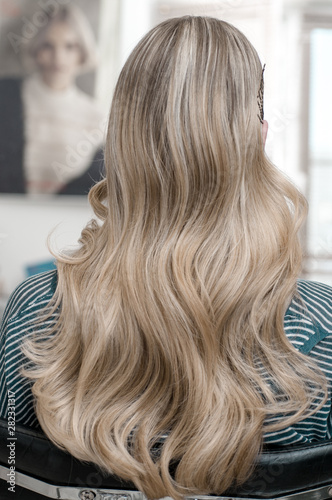 Blonde girl with long hair with wave hairstyle