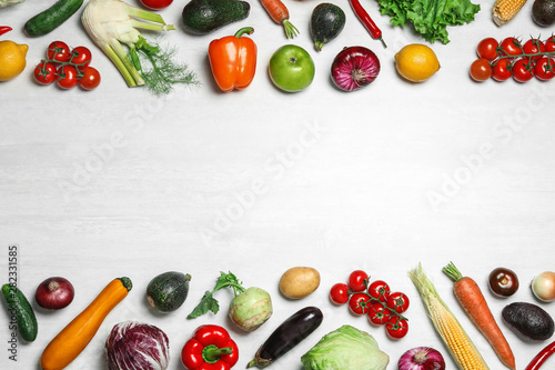 Frame made of fresh vegetables on light table, flat lay. Space for text