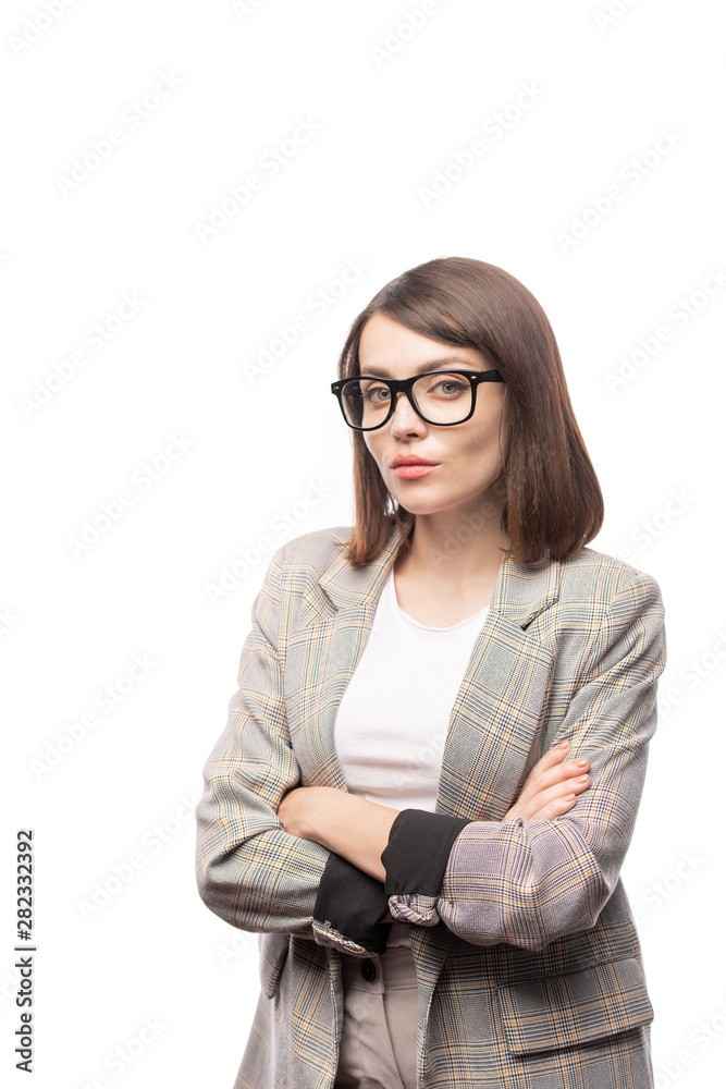 Pretty young teacher in formalwear looking at you with strict expression Pretty young teacher in formalwear looking at you with strict expression