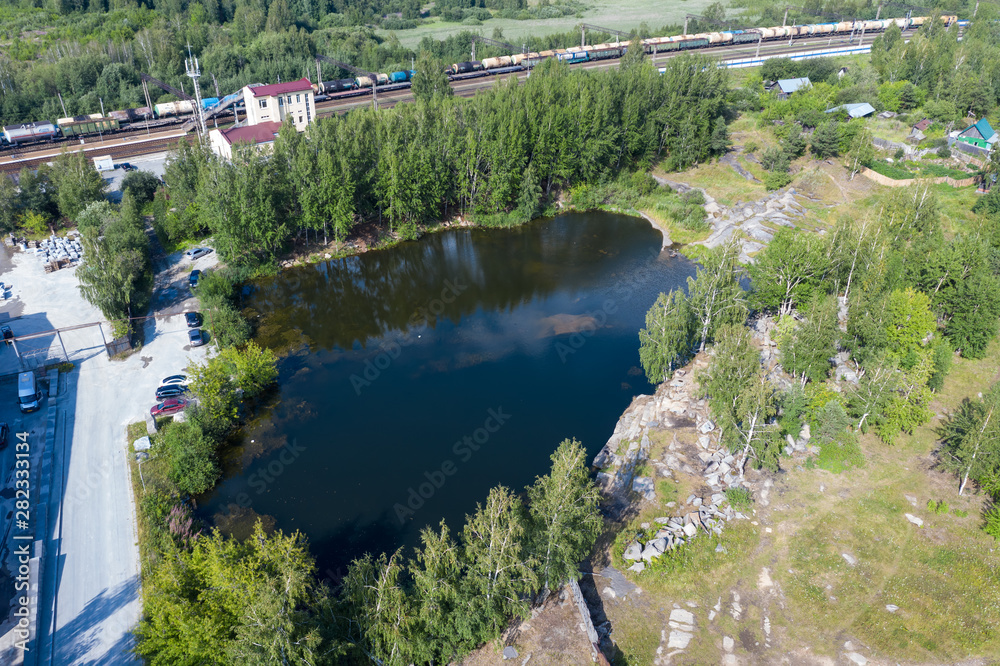 Aerial view of Quarry. Dive site. Famous location for fresh water divers and leisure attraction. Quarry now explored by scuba divers. Flooded quarry, adrenaline hobby.