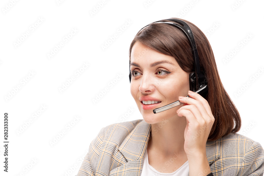 Pretty young polite manager of call center talking to one of clients Pretty young polite manager of call center talking to one of clients
