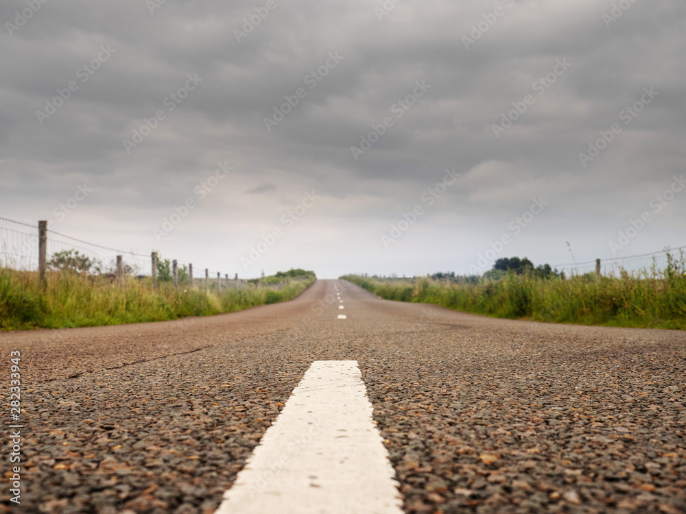 Asphalt road, low angle, Cloudy sky, Concept driving, way to your destination.