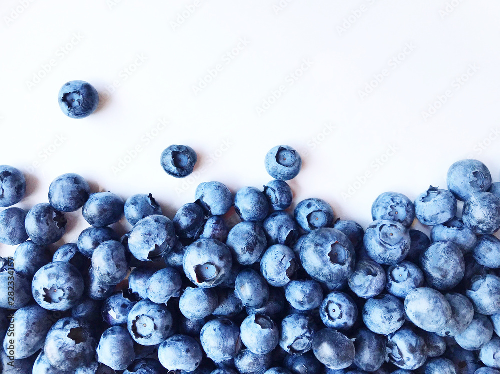 Berry background. Fresh berry blueberries on a white background. Concept of healthy and diet food.