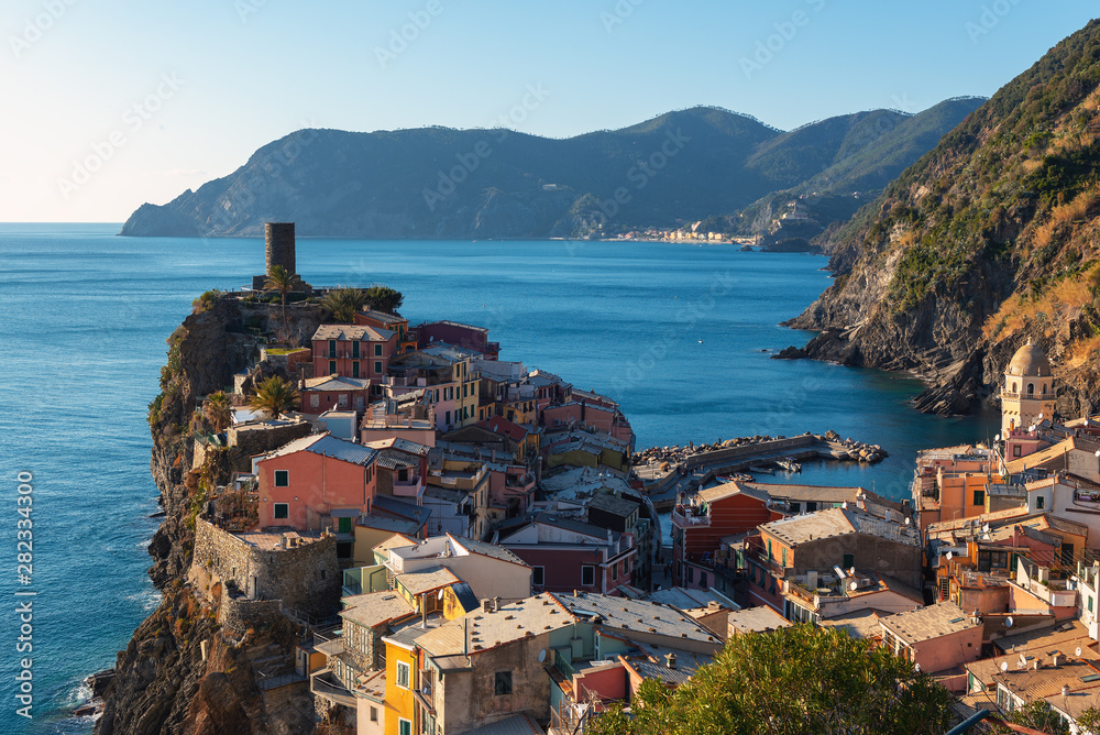 Vernazza town, located in Cinque Terre national park, with beautiful houses and old fortress ruins
