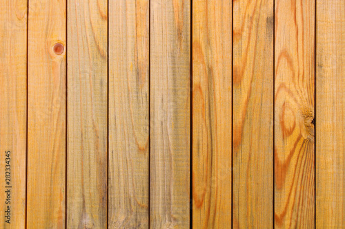 Thin processed wood planks. Close-up. Vertical view. Background. Texture.