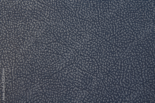 Leatherette. Faux black leather. Close-up. Background. Texture.