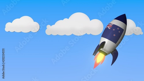 Rocket with flag of New Zealand flies in the sky. National success or space program related loopable motion background photo