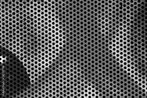Black and white abstract background. Perforated monochrome texture