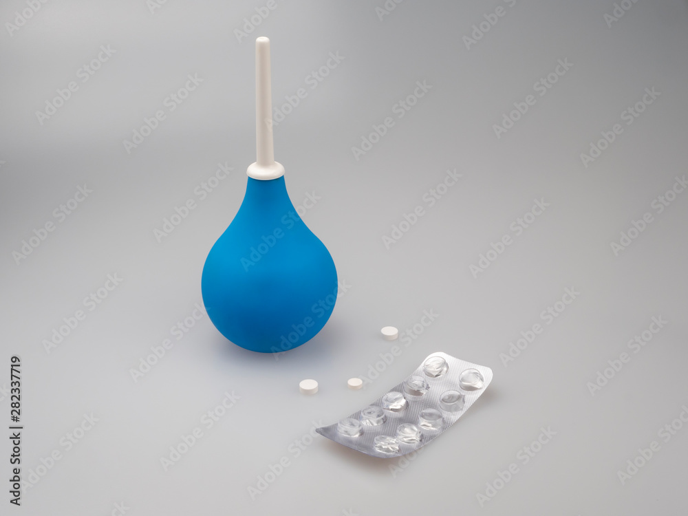 Diarrhea. Enema, douche. Empty currency from pills. On a neutral background. Still life. Diarrhea. Enema, douche. Empty currency from pills. On a neutral background. Still life.
