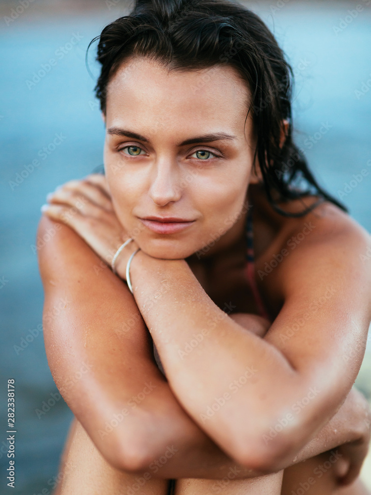 Beautiful fit surfing girl on surfboard on in the ocean. Woman ride good wave. Beautiful fit surfing girl on surfboard on in the ocean. Woman ride good wave.