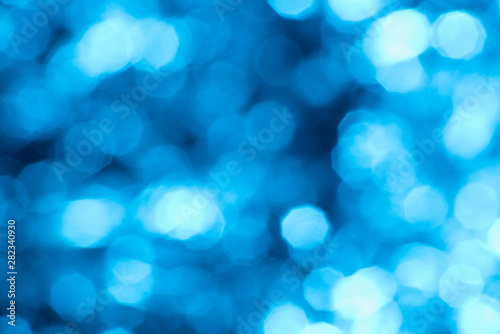Blue glowing blurred background with bokeh