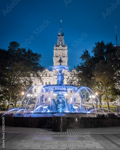 The Tourny fountain (fontaine de Tourny) in Old Quebec city, Canada. The National Assembly of Quebec is in background
