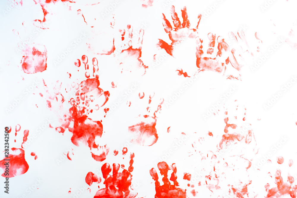 Hands of a little boy painting with watercolors on white paper sheet. Little boy with a brush and paints.  Back to school concept. Copyspace.