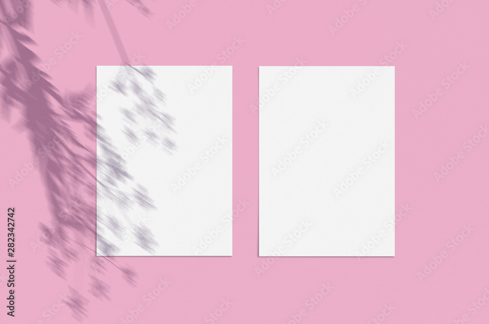 Blank white vertical paper sheet 5x7 on pink background with shadow overlay. Modern and stylish greeting card or wedding invitation mock up Blank white vertical paper sheet 5x7 on pink background with shadow overlay. Modern and stylish greeting card or wedding invitation mock up