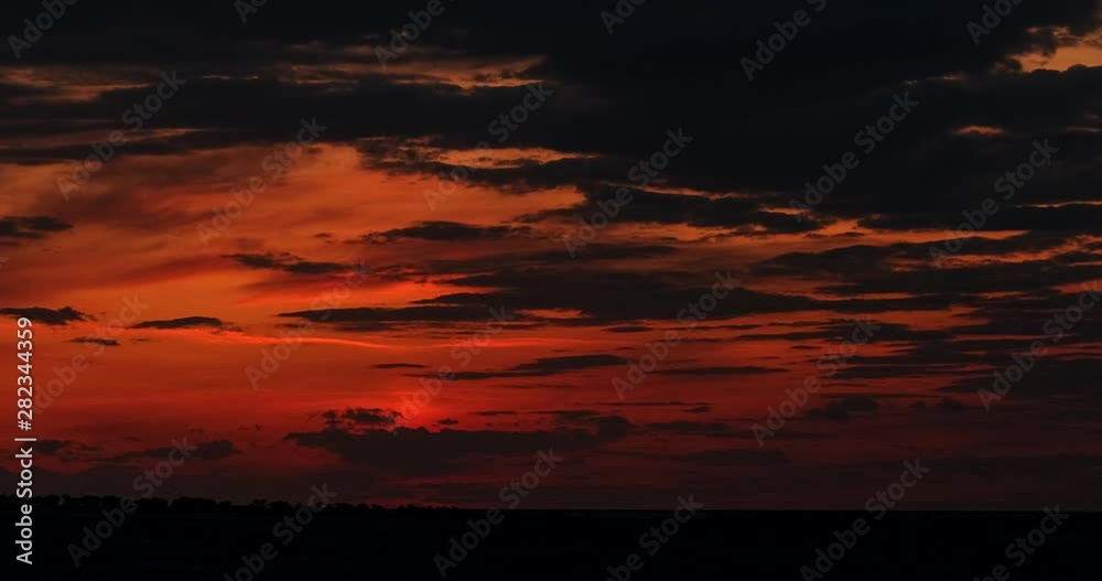 Dramatic sunset clouds timelapse. Apocalyptic nature landscape time lapse. Storm clouds moving across the sky against the setting sun. Skyline at dusk. Beautiful evening view. Epic sunrise scene. 4K.