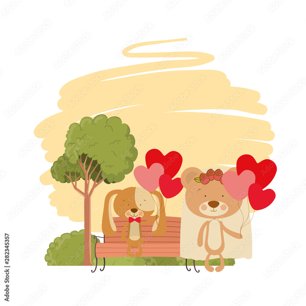 Fototapeta premium cute animals sitting in the park chair