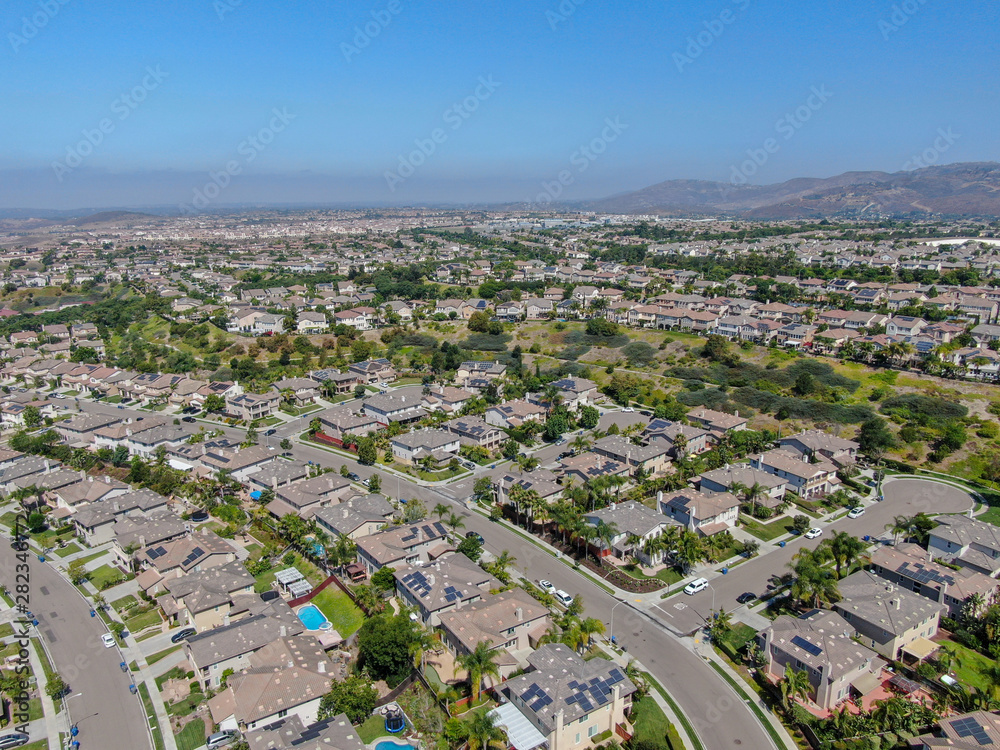 Aerial view suburban neighborhood with big villas next to each other in
