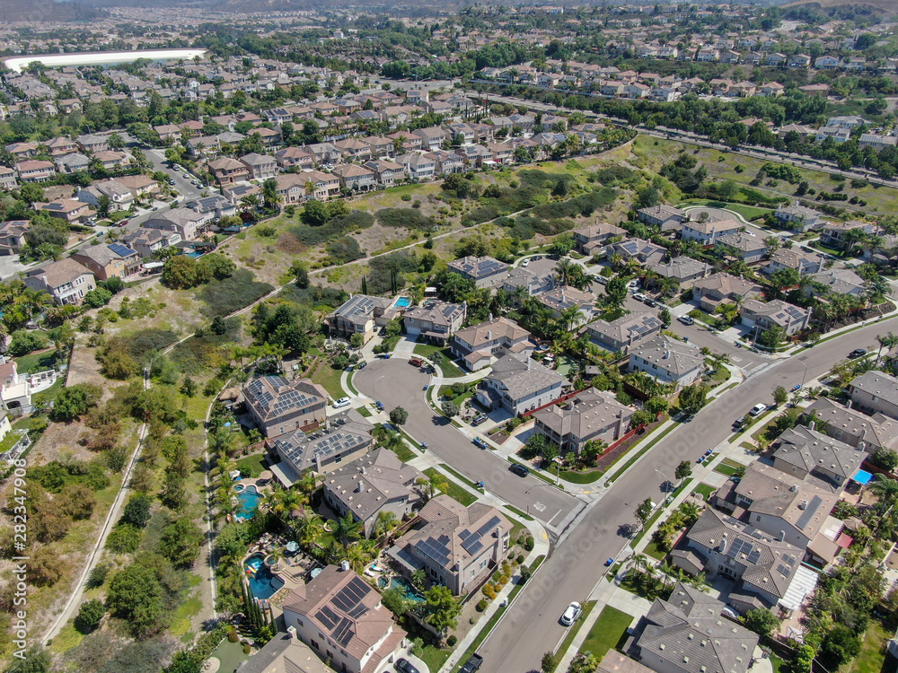 Aerial view suburban neighborhood with  big villas next to each other in Black Mountain, San Diego, California, USA. Aerial view of residential modern subdivision luxury house.