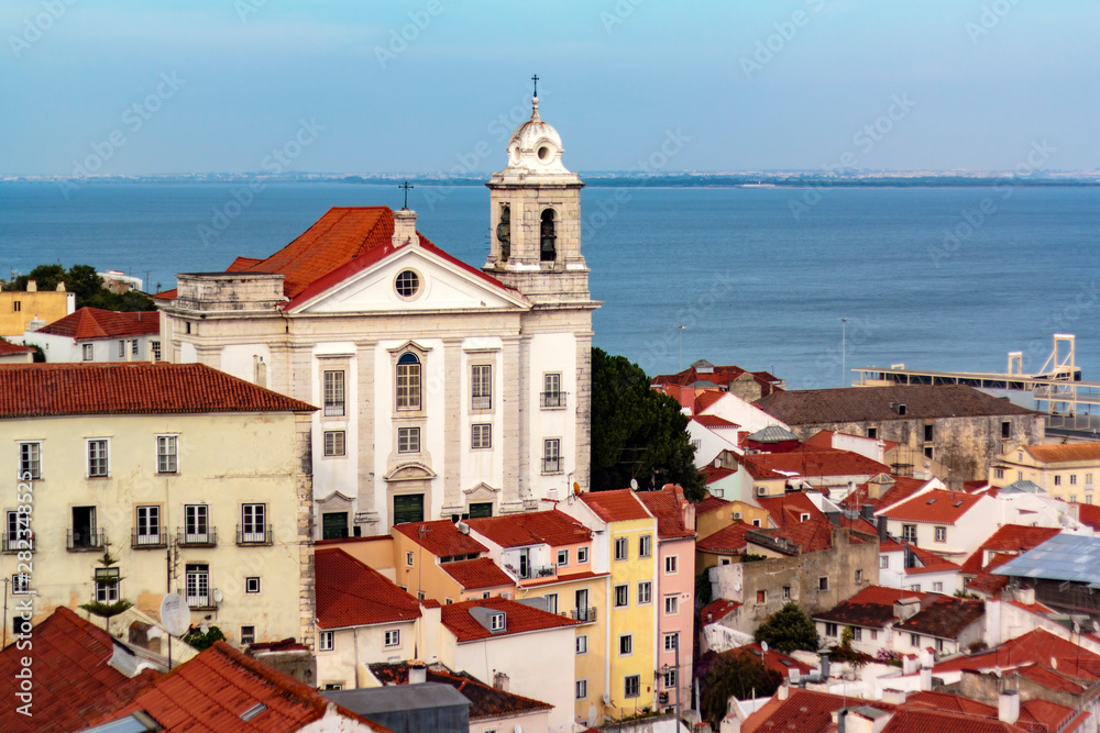 Portuguese church and typical portuguese houses with river on the background
