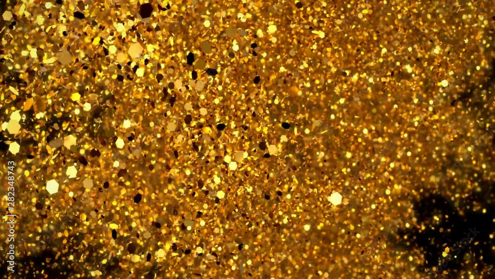 Abstract Golden glitter explosion in slow motion Bokeh background with shining defocus blurred sparkles dust macro close up with alpha channel