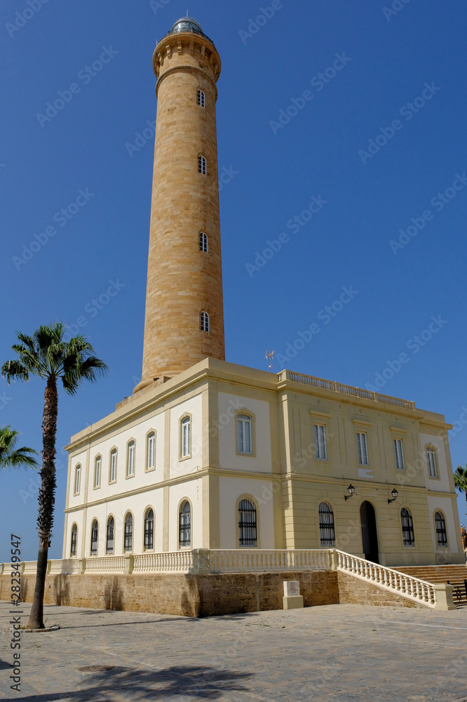 Stone lighthouse in Chipiona in Andalusia in Spain in october.