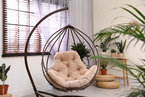 Fotografie, Obraz Comfortable swing chair with pillow in room interior