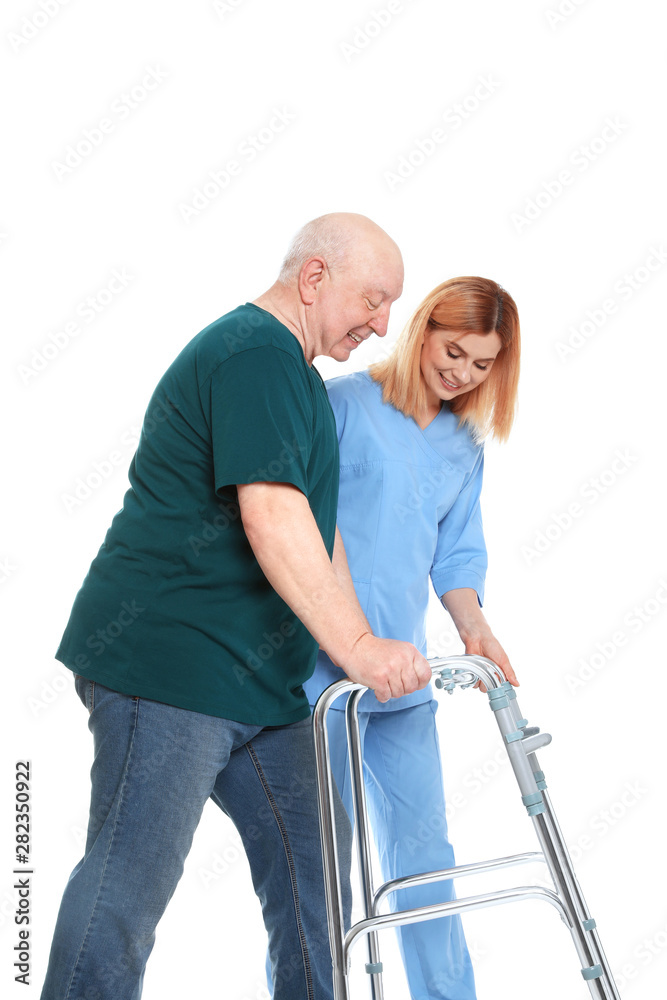 Caretaker helping elderly man with walking frame on white background Caretaker helping elderly man with walking frame on white background