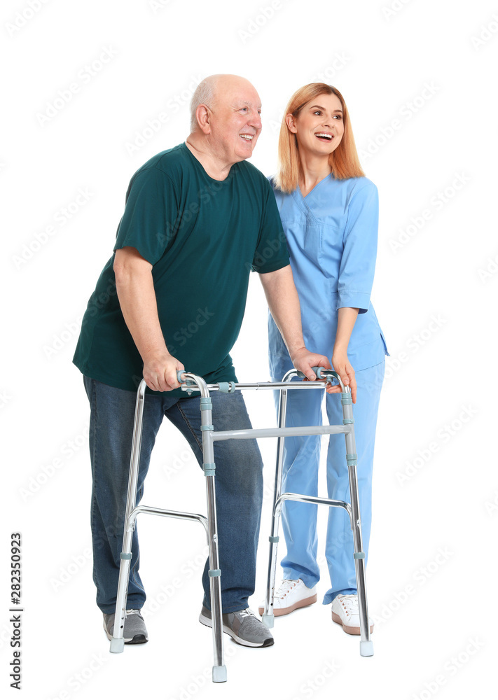 Caretaker helping elderly man with walking frame on white background Caretaker helping elderly man with walking frame on white background