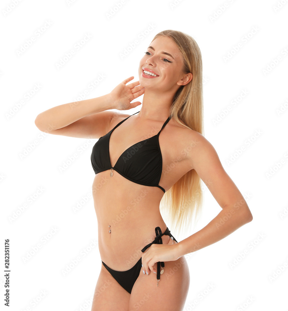 Obraz premium Pretty young woman wearing stylish bikini on white background