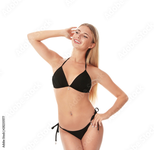 Pretty young woman wearing stylish bikini on white background © New Africa