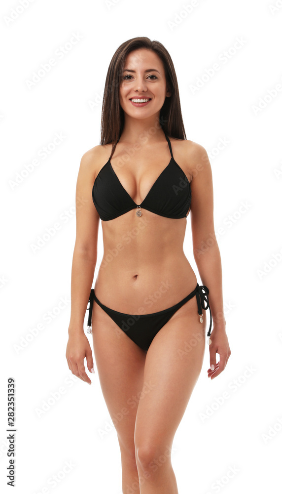 Pretty sexy woman with slim body in stylish black bikini on white  background Stock Photo | Adobe Stock