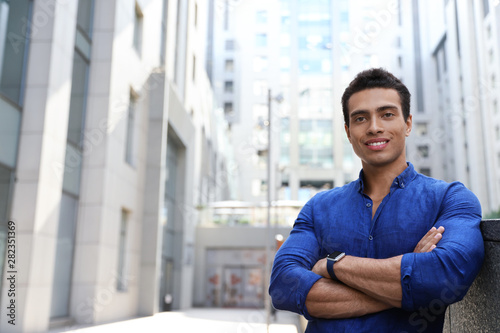 Handsome young African-American man on city street. Space for text Free Download Handsome young African-American man on city street. Space for text - GFXLoad