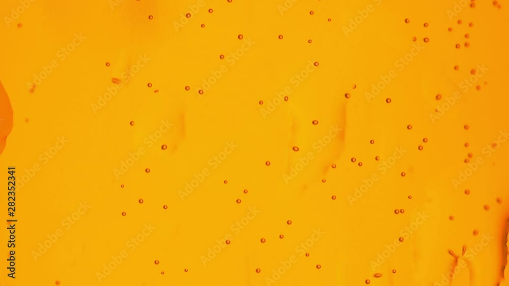 Close up background of rising bubbles inside a glass champagne or beer. Soda water with bubbles. Celebration and party background. Close up background of rising bubbles inside a glass champagne or beer. Soda water with bubbles. Celebration and party background.