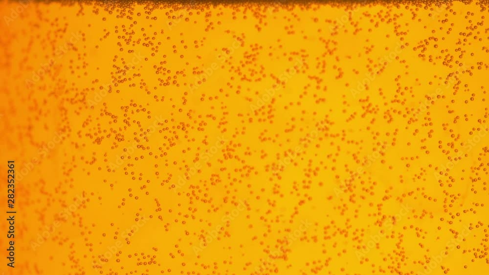 Close up background of rising bubbles inside a glass champagne or beer. Soda water with bubbles. Celebration and party background. Close up background of rising bubbles inside a glass champagne or beer. Soda water with bubbles. Celebration and party background.