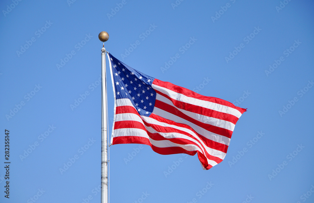 US National Flag against the blue sky.