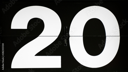 Close-up Flip clock Date numbers 20 on black background, Time concept..