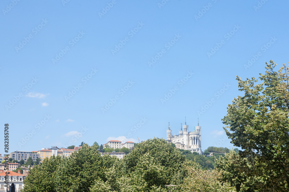 Panorama of Lyon. France, with a focus on Colline de Fourviere Hill with its Basilica, Notre Dame de Fourviere Basilica. It is a Catholic minor basilica and a major landmark of Lyon Panorama of Lyon. France, with a focus on Colline de Fourviere Hill with its Basilica, Notre Dame de Fourviere Basilica. It is a Catholic minor basilica and a major landmark of Lyon