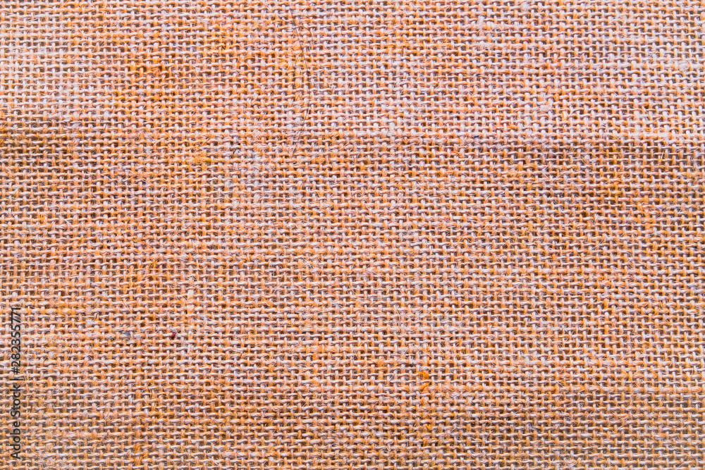 Hessian sackcloth burlap woven texture background / cotton woven fabric background with flecks of varying colors of beige and brown. with copy space. office desk concept. Hessian sackcloth burlap woven texture background / cotton woven fabric background with flecks of varying colors of beige and brown. with copy space. office desk concept.