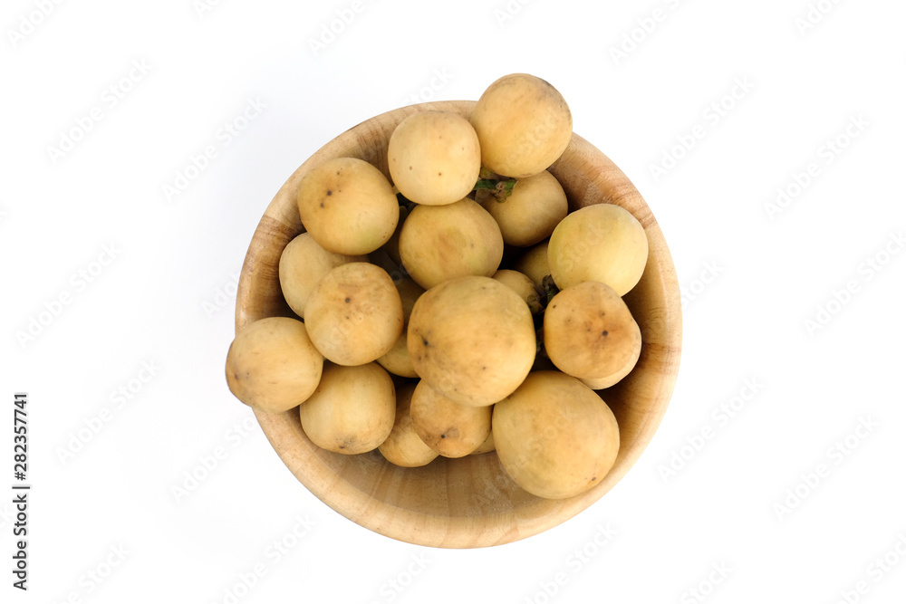 LongKong is placed on a wooden tray. Tropical fruit, Langsat, lanzones, Lansium parasiticum on a white background. - Image LongKong is placed on a wooden tray. Tropical fruit, Langsat, lanzones, Lansium parasiticum on a white background. - Image
