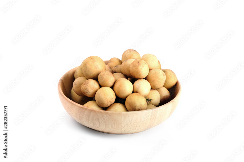 LongKong is placed on a wooden tray. Tropical fruit, Langsat, lanzones, Lansium parasiticum on a white background. - Image LongKong is placed on a wooden tray. Tropical fruit, Langsat, lanzones, Lansium parasiticum on a white background. - Image