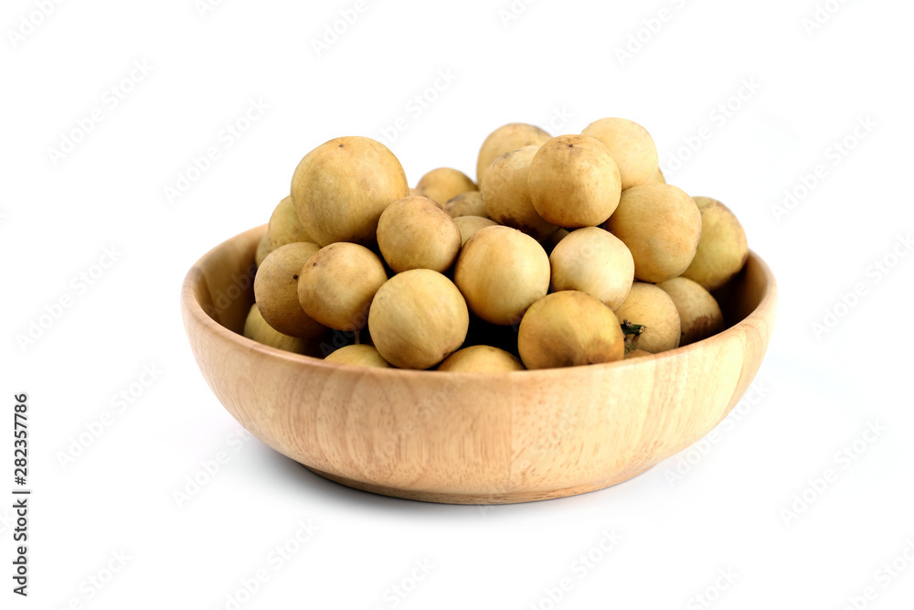 LongKong is placed on a wooden tray. Tropical fruit, Langsat, lanzones, Lansium parasiticum on a white background. - Image LongKong is placed on a wooden tray. Tropical fruit, Langsat, lanzones, Lansium parasiticum on a white background. - Image